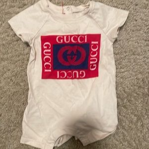Used once Gucci onesie 3-6 months